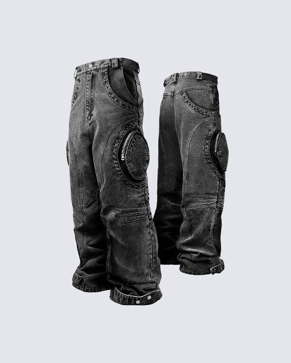 Bold retro-washed black denim pants by KIIKIO, featuring unique zippered knee details and a relaxed fit for a standout streetwear look.